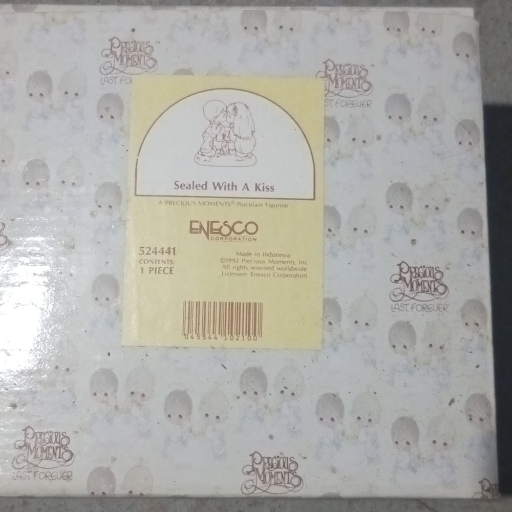 Sealed with a kiss precious moments figurine